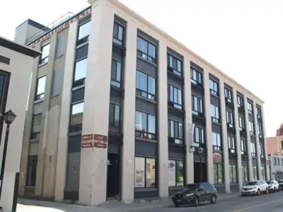 A cool studio apartment with high ceilings in a converted factory building, where original character...