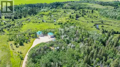 Perched on the edge of a spectacular coulee and overlooking Red Willow Creek, this extraordinary hom...
