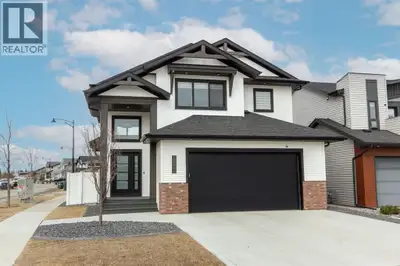 Welcome to this stunning modified bi-level located across from the pond in Evergreen! The bright, op...