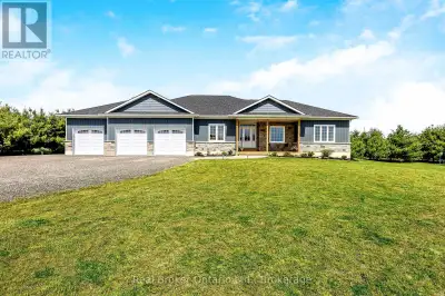 This stunning custom-built bungalow is nestled on a peaceful 1.25-acre lot, offering modern living i...