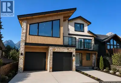 In the heart of Canmore, this rare 5-bedroom, 5-bath home delivers the kind of privacy and natural c...
