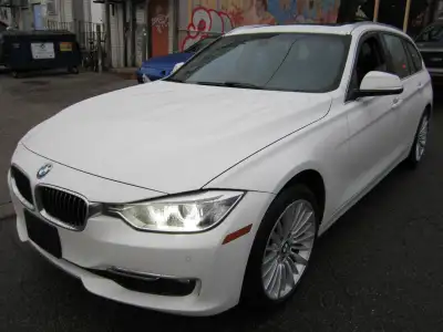 ALL WHEEL DRIVE WAGON. FINISHED IN ARTIC WHITE WITH BLACK LEATHER INTERIOR. ALLY WHEELS WITH NEW TIR...