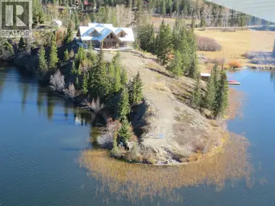 Stunning 9.5-acres on SW facing peninsula on Nimpo Lake offers 1,600 ft of lake frontage and 330-deg...