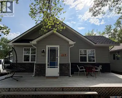 Welcome to 107 Mistusinne Street, A charming year round retreat at the lake backing onto a 9 hole go...