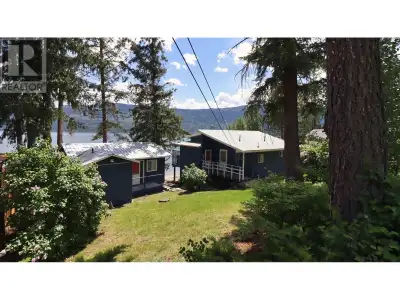 Character cottage with awesome guest cabin! This nicely updated year-round home sits on a mature, 0....
