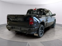 Presenting the stunning 2026 Ram 1500 Sport in an elegant black finish, equipped with a robust 4x4 d... (image 4)
