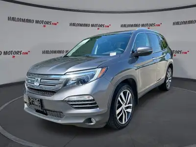 This used 2018 Honda Pilot Touring AWD is a roomy, family-ready SUV with smart features and proven V...