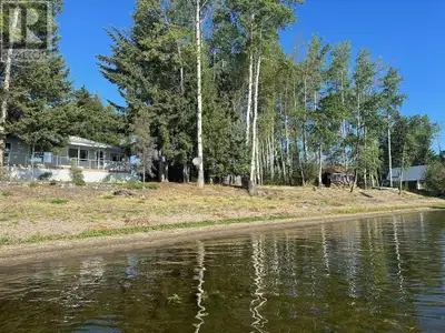 Waterfront home on one of Fraser Lake's nicest beaches that offers spectacular sunrises and calm wat...