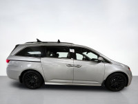 Our used family-friendly 2014 Honda Odyssey Touring is shown in stunning Alabaster Silver Metallic.... (image 5)