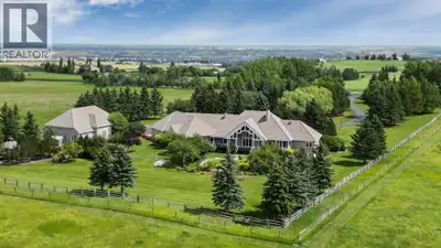 Set on 4.94 acres in the scenic beauty of Rural Foothills County, this impeccably maintained bungalo...