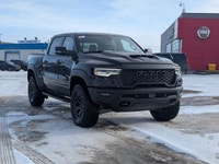 The 2026 Ram 1500 RHO Crew Cab in Diamond Black Crystal Pearl delivers bold styling and high-perform... (image 8)
