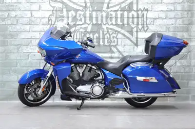 ONLY 12,035 km on this one owner, last year, 2017 Victory Cross Country Tour! Beautiful Blue Fire pa...