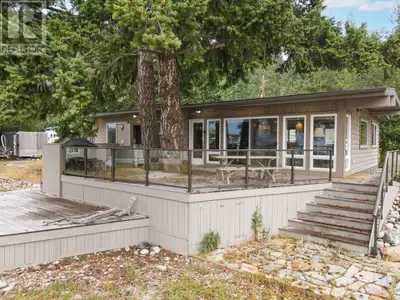 Experience the ultimate in lakeside living with this beautifully updated beachfront home on the shor...
