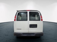 The 2017 Chevrolet Express Cargo Van in a classic white, rear-wheel drive design is tailored for tho... (image 6)