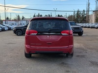 The 2026 Chrysler Grand Caravan SXT in Red Hot Pearl with a Black interior combines style, comfort,... (image 4)