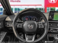 The 2026 Honda Civic Sedan Hybrid Sport Touring features an integrated navigation system to guide ev... (image 8)