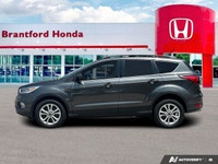 Confident command meets exceptional convenience in this superb gray 2019 Ford Escape SEL sport utili... (image 1)