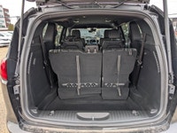 The 2026 Chrysler Grand Caravan SXT in Diamond Black Crystal Pearl with a Black interior combines fa... (image 5)
