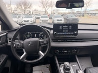 The 2023 Mitsubishi Outlander PHEV LE is a plug-in hybrid SUV that combines fuel efficiency, electri... (image 7)