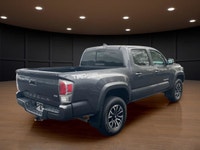 The 2023 Toyota Tacoma TRD Sport V6 in stunning gray is ready to tackle any terrain with its robust... (image 5)