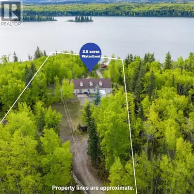 Exceptional 2.5-acre lakefront estate with panoramic lake and mountain views, private water access,...