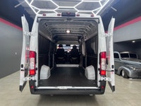 The 2025 Ram ProMaster Cargo Van in a clean white finish, equipped with front-wheel drive, is design... (image 6)