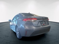 The 2023 Toyota Corolla Hybrid LE in stunning gray, boasts a fuel-efficient FWD drivetrain known for... (image 7)