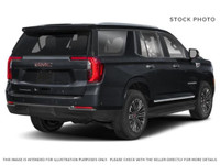 The 2026 GMC Yukon 4WD AT4 Ultimate in striking Onyx Black with Obsidian Rush interior and red accen... (image 4)