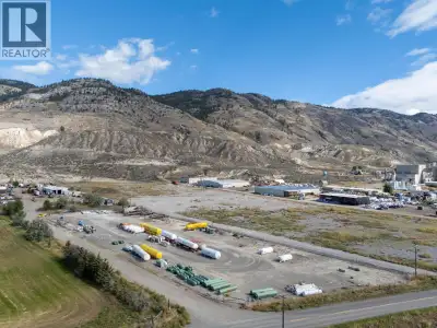 Light industrial property in Kamloops, BC featuring over 12 acres of land, metal shop with office (6...