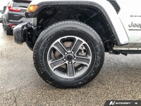 This Jeep Wrangler has a powerful Gas/Electric V-6 3.6 L/220 engine powering this Automatic transmis... (image 8)