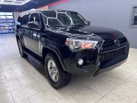 Experience the rugged elegance of the 2016 Toyota 4Runner SR5, presented in a commanding Black finis... (image 7)