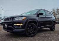 Step into the commanding presence of the 2018 Jeep Compass Altitude 4x4, cloaked in a stunning black... (image 1)