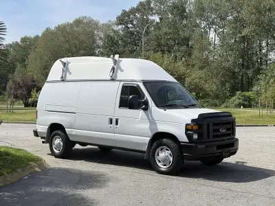 This 2008 Ford Econoline E-350 Super Duty high roof cargo van is powered by a 5.4L V8 paired with an...