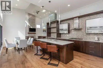 Beautiful MODERN home featuring EXTENSIVE UPGRADES AND HIGH END FINISHINGS. It boasts high ceilings...