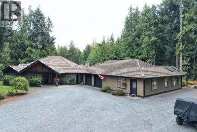 2.5 acres. A sprawling rancher. A completely separate one-level suite. Set among towering trees and...