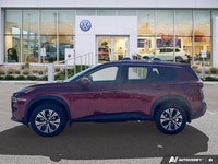 Experience enhanced visibility and an open-air feel in this stunning red 2021 Nissan Rogue SV, featu... (image 1)