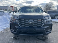 Conquer every adventure with the rugged yet refined 2023 Honda Passport TrailSport, a vehicle engine... (image 1)