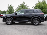 The 2023 Nissan Rogue AWD S in a sleek black hue complements its AWD capabilities, delivering a smoo... (image 4)
