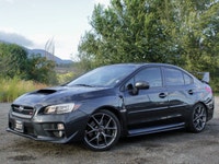 Feel the thrill of the road with the 2017 Subaru WRX STI Sport, finished in a striking shade of gray... (image 1)