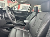 The 2023 Buick Envision Essence, presented in a sophisticated Gray finish, masterfully blends luxuri... (image 4)