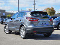 The 2023 Nissan Qashqai SV in a striking color, equipped with an automatic transmission and an all-w... (image 1)