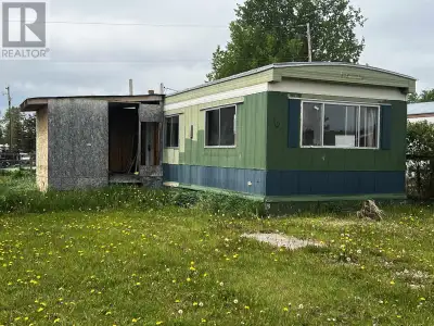* PREC - Personal Real Estate Corporation. Embrace the potential of this 2-bedroom, 1-bath trailer l...