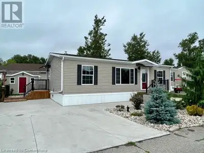 Cottage like living close to the city! This 2 bed, 1 bath, 864 Sq ft modular home in the well manage...