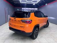 For a quick response please text 403-820-9940. AMVIC licensed business The 2026 Jeep Compass Trailha... (image 1)
