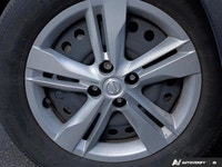 Navigate city streets with confidence and style in the 2022 Nissan Kicks S, striking in Electric Blu... (image 5)