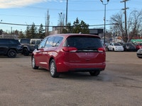 The 2026 Chrysler Grand Caravan SXT in Red Hot Pearl with a Black interior offers a bold look, spaci... (image 3)