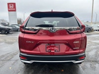 Command the road in the breathtaking Radiant Red Metallic 2021 Honda CR-V Touring, a sophisticated s... (image 5)