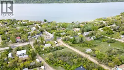Escape to the serene shores of Saskatchewan Beach and imagine your perfect cabin perched on this inc...