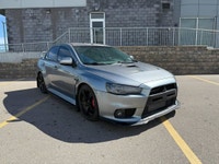 This 2014 Mitsubishi Lancer Evolution delivers pure performance with its turbocharged 2.0L engine, a... (image 2)