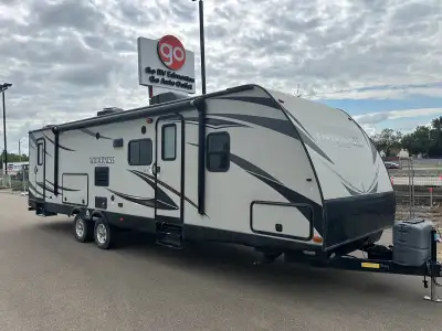 The 2015 Wilderness 312SBH is a spacious travel trailer designed with families and campers in mind....